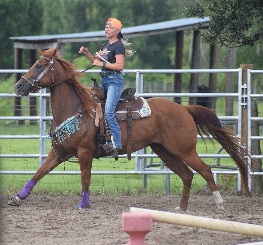Juli Drymon eases her horse as she finishes her event.