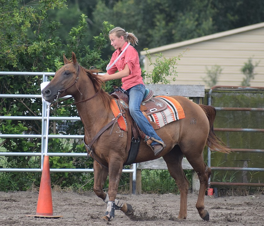 Sarasota's Riley Rebeglia, 13, begins riding in the relay race.