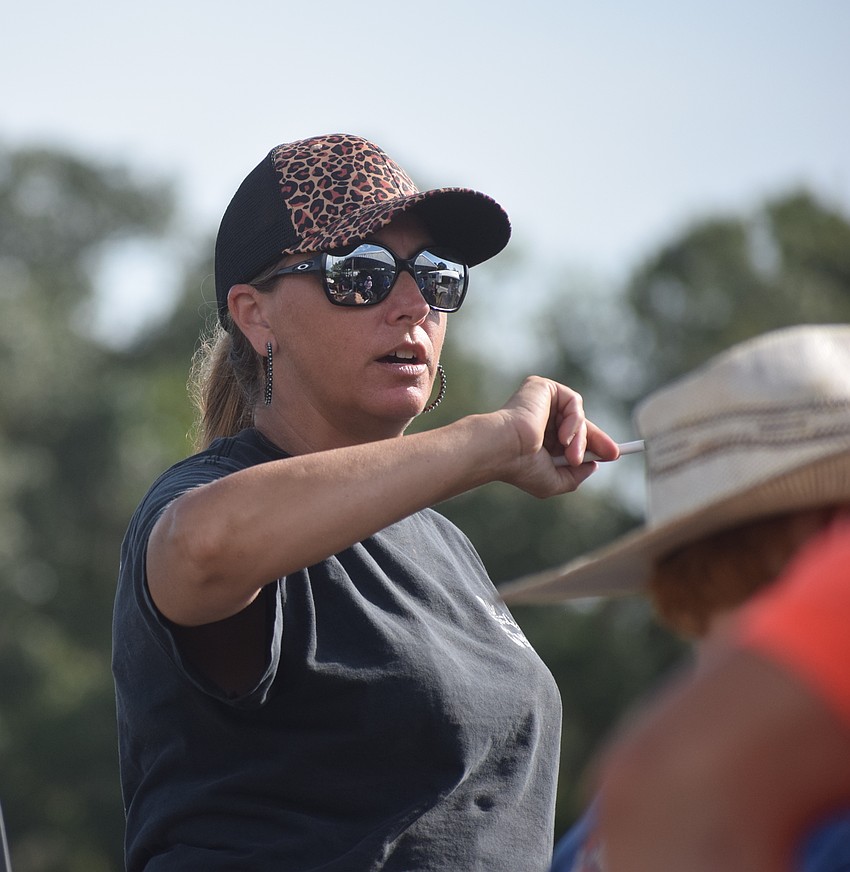 Kris Anderson, one of the camp directors, gives instructions before the competition.