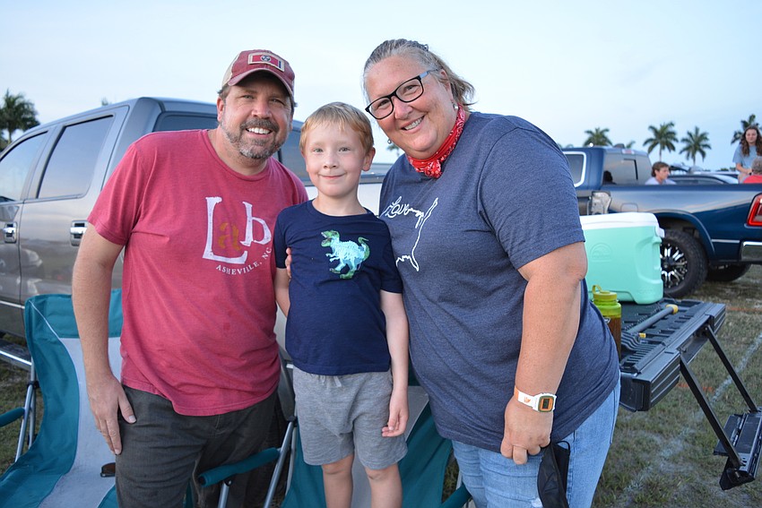 Paul Archacki, Ollie Archacki and Emily Sperling, of Sarasota, set up a hammock from which to view the fireworks.