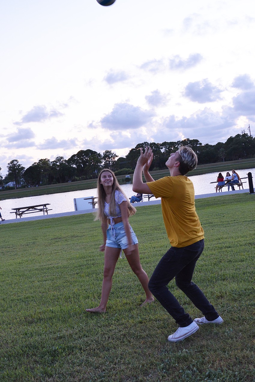 Braden River High School 17-year-old Faith Affolter and 16-year-old Colin Watkins test their volleyball skills before the show.