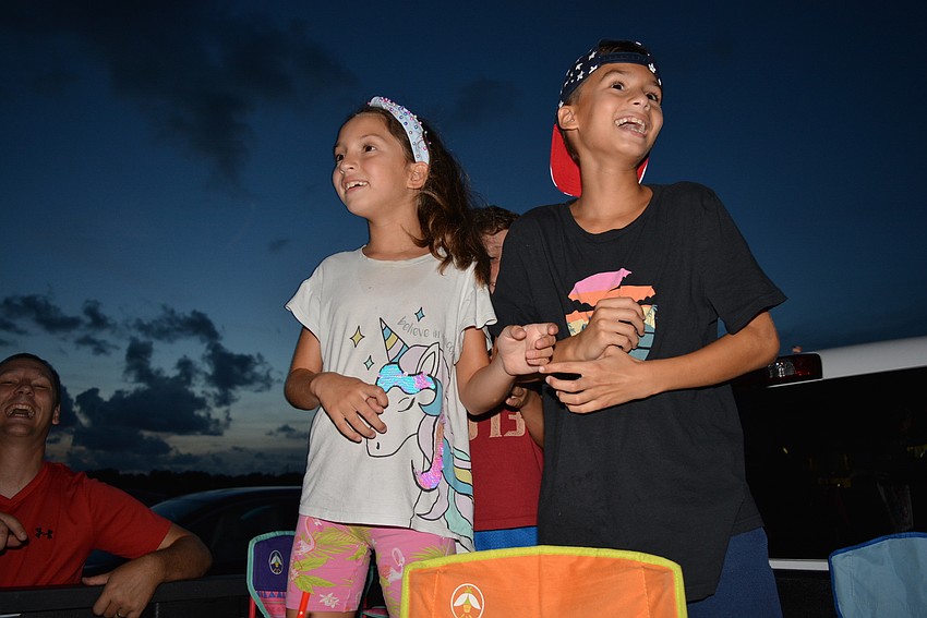 Parrish's Samara and Joel Pineda excitedly watch as fireworks begin to shoot across the skyline.