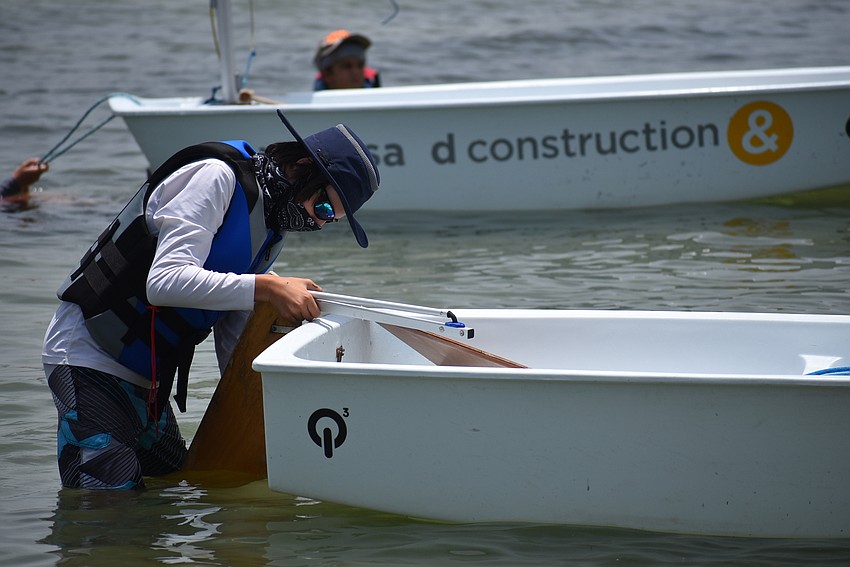 Pierce McCarthy adjusts his boat.