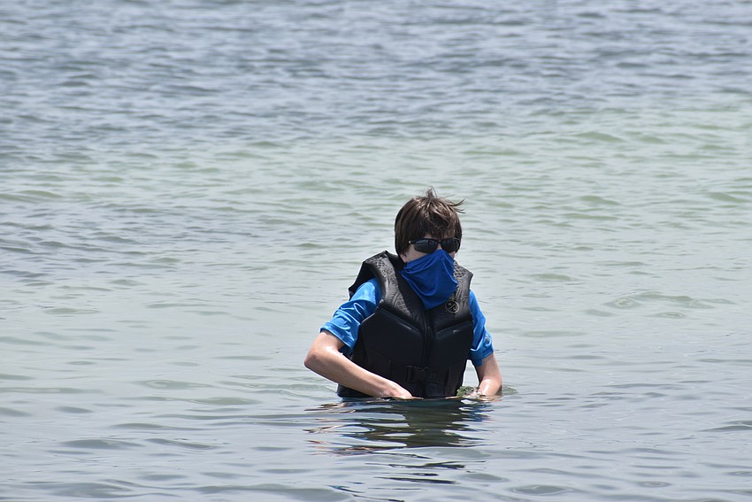 Patrick Van Eyck kept his mask on in the water as he was closer to other campers.