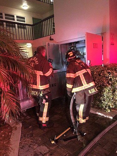 Longboat Key firefighters put out a fire on July 4 at the Portobello condominium at 3235 Gulf of Mexico Drive. Photo courtesy of Dean Congbalay.