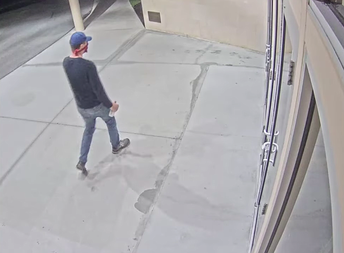 The sheriffâ€™s office said the suspect was shown wearing a blue baseball cap, a dark long-sleeved shirt, blue jeans and gray athletic shoes during both incidents overnight, covering his face with a red bandana. Courtesy image.