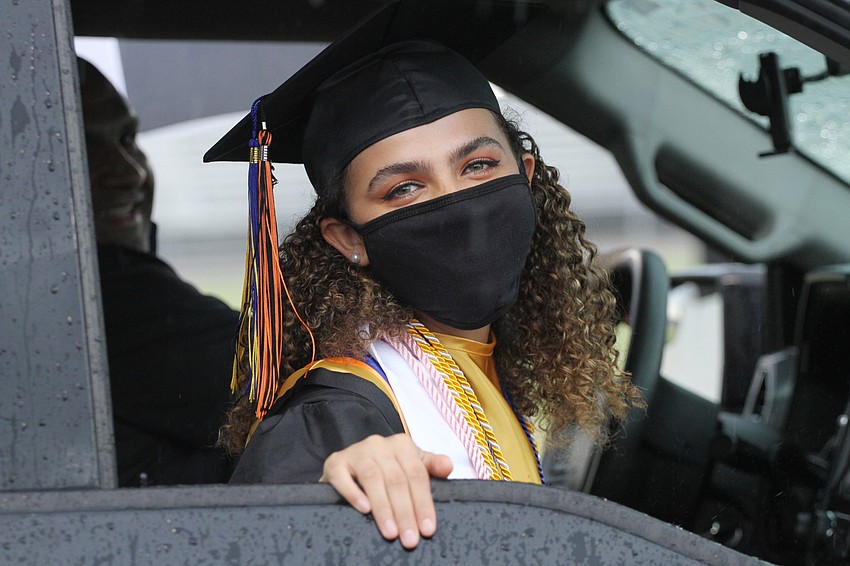 Keara Escobedo looked on from her car.