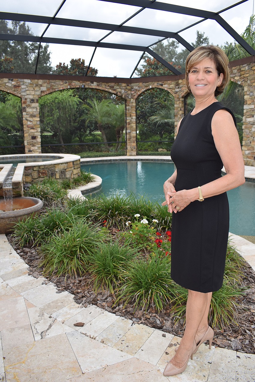 Realtor Donna Soda of the Soda-Stavola Group said her favorite part of the home is the massive lanai. Photo by Jay Heater