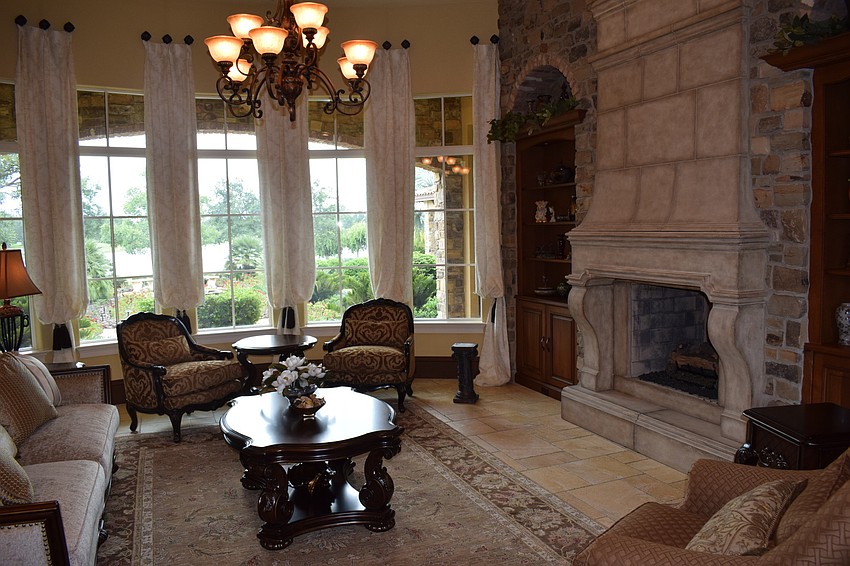 A two-way fireplace highlights a sitting room. Photo by Jay Heater