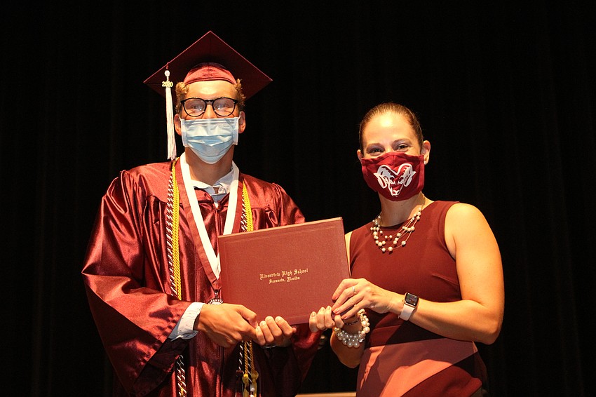 Christopher Barton accepted his degree.