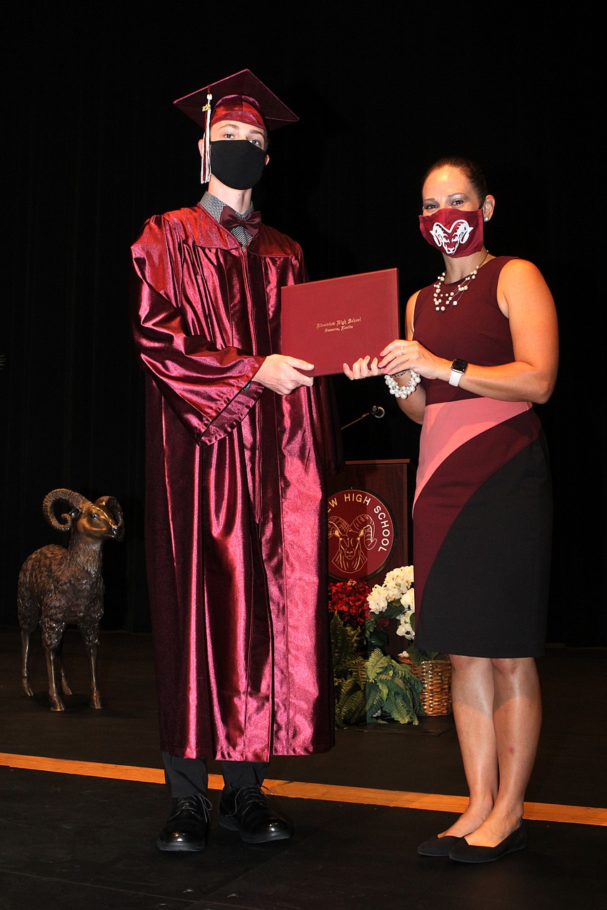 John Jones accepted his diploma.