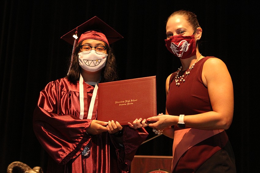 Maria Ledesma accepted her diploma.
