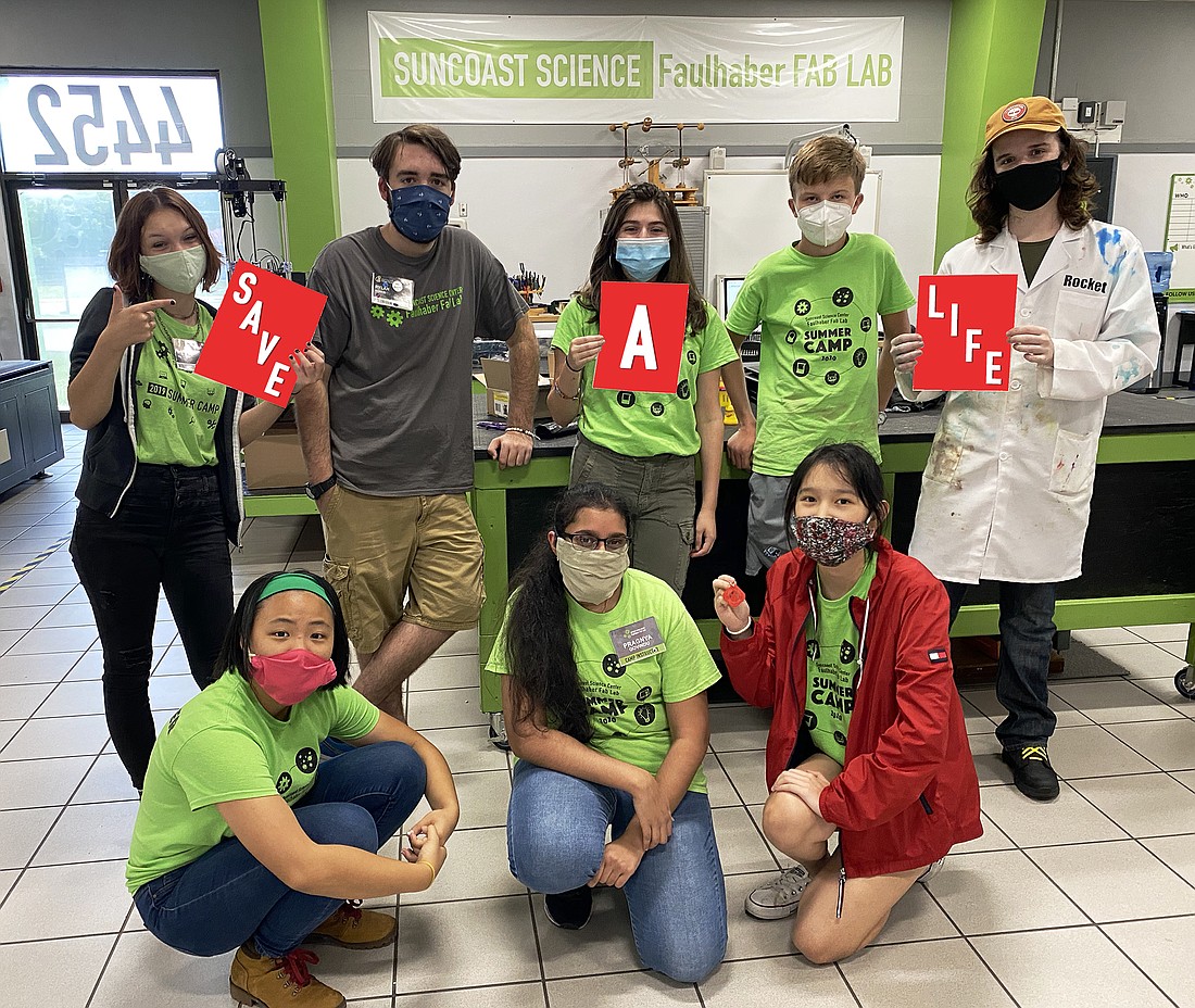 Science Center student volunteers Mia Merrell, Rylan Monge, Natalie Carrion, Max Fischer, Rocket Burns, Julia Chen, Pragnya Govindu and Claire Wang encourage people to donate on July 29. Courtesy Photo