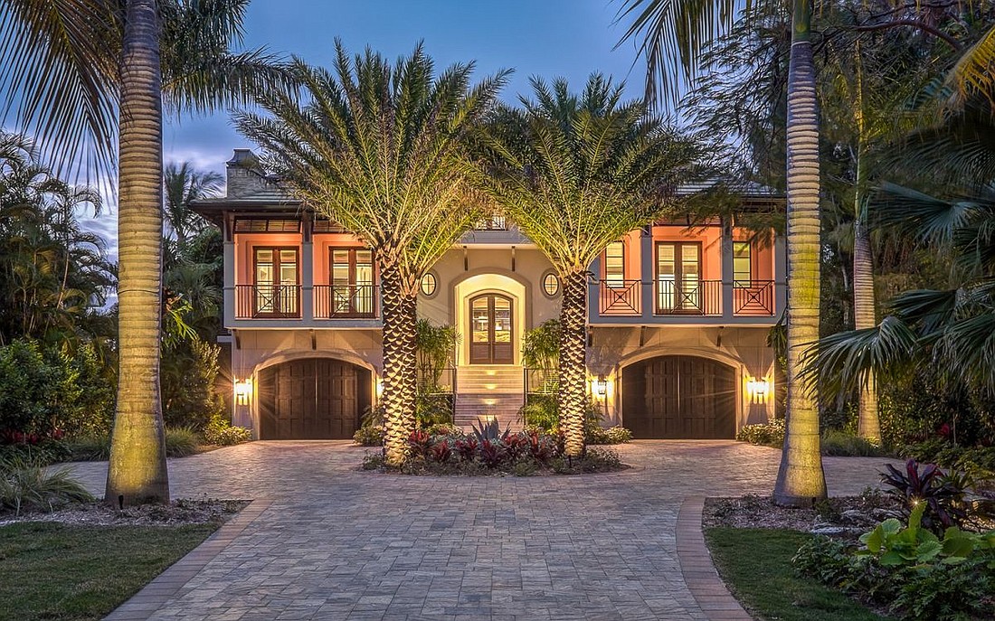 The home at 6021 Gulf of Mexico Drive was built in 2015  with four bedrooms, five full baths, three half-baths and 7,174 square feet of living area.
