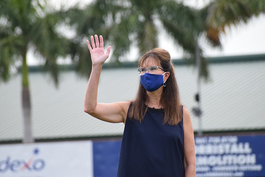 Cynthia Saunders, superintendent of the School District of Manatee County, waves to families at Braden River High School's graduation ceremony.