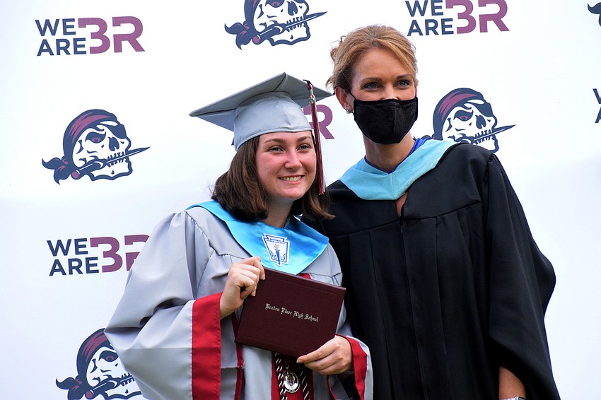 Tess Zambella celebrates her graduation with Sharon Scarbrough, principal of Braden River High School.