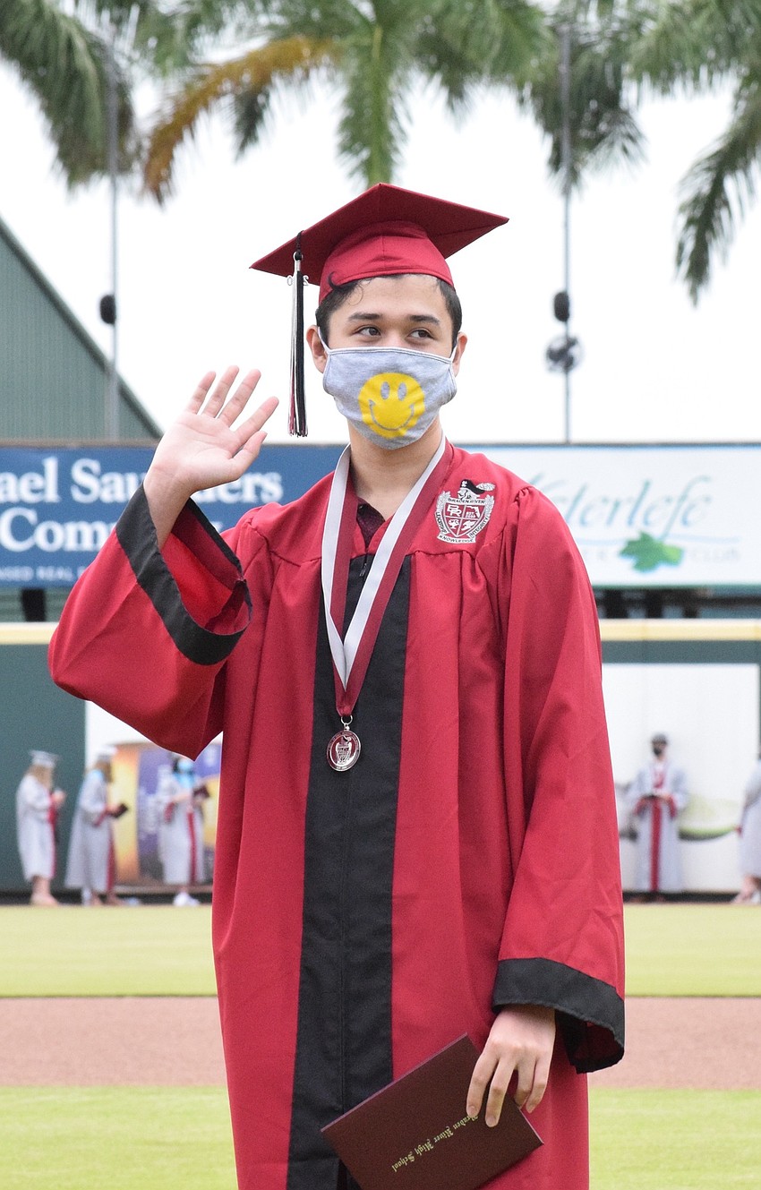 Elijah Bolle waves to his family in the stands.