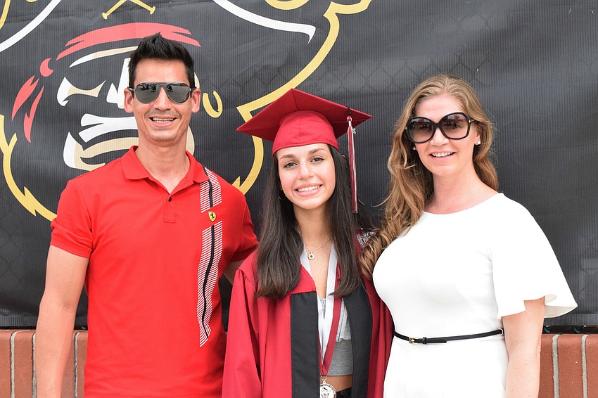 Marco, Daniela and Charisti Madrid celebrate Daniela Madrid's graduation. 