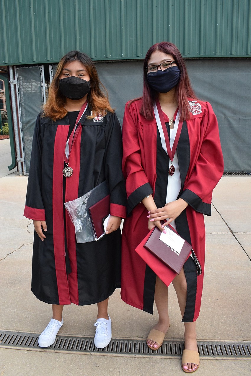 Victoria Garcia and Vivianna Garcia get in line for their graduation ceremony. 