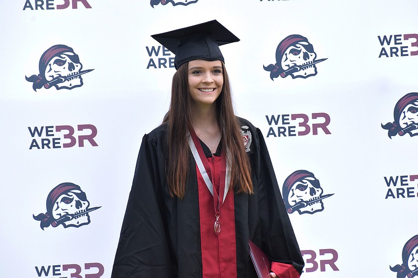 Hailee Chapin smiles after receiving her diploma.