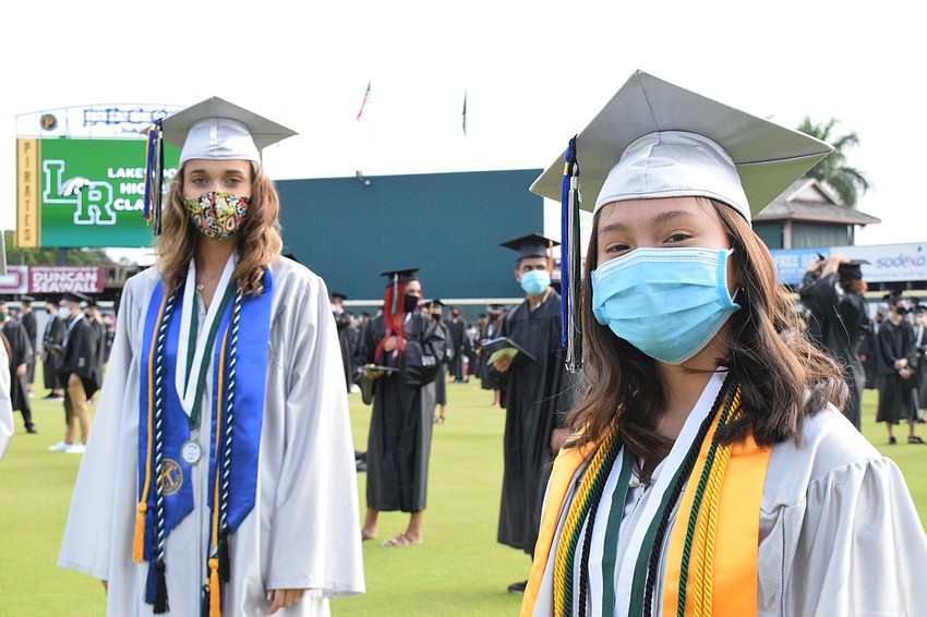 Isabella Liberti and Kelsey Le line up for graduation. 