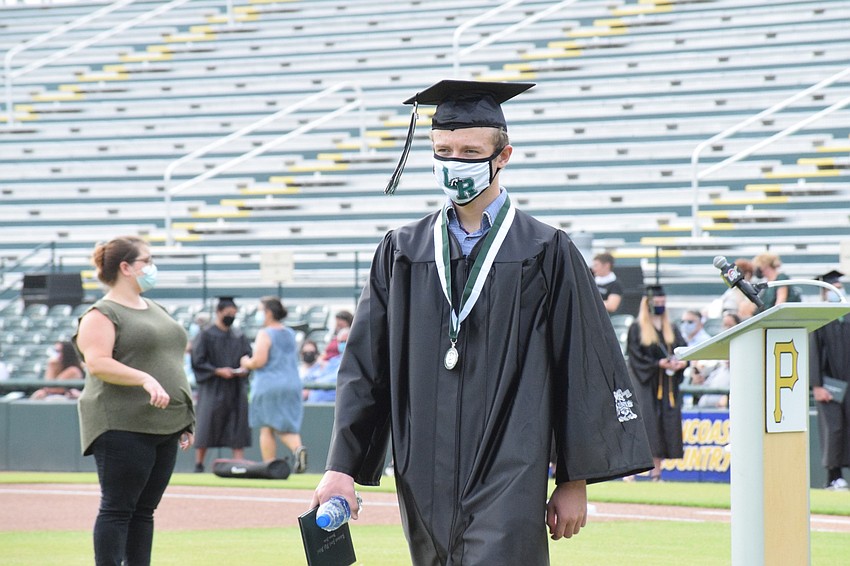Jack Beatenhead wears a Lakewood Ranch High School mask during his graduation ceremony.
