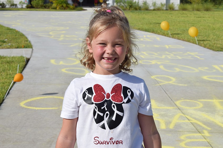Charlotte Wells celebrates her last day of chemotherapy.