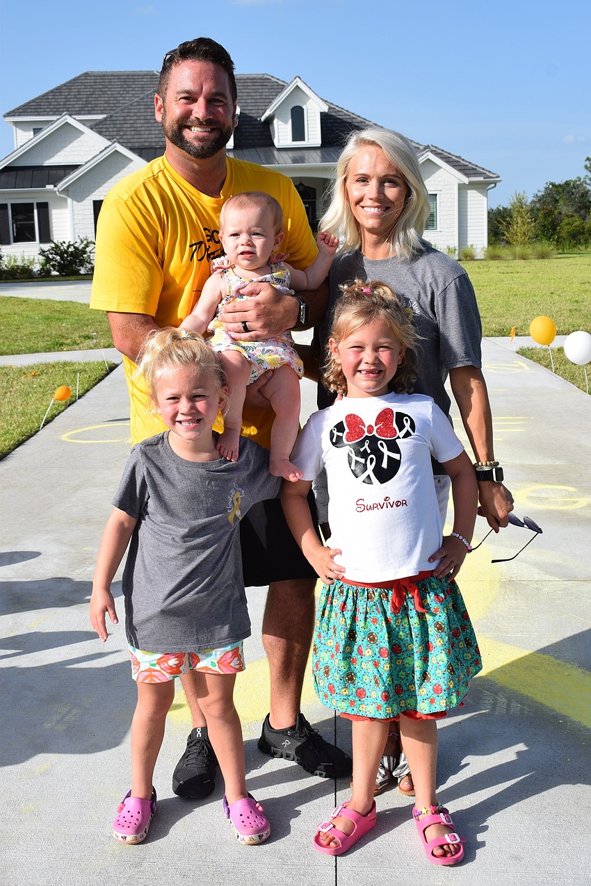 The past two years have brought (back) Matt, Madison, Rachel, (front) Savannah and Charlotte Wells closer as a family.