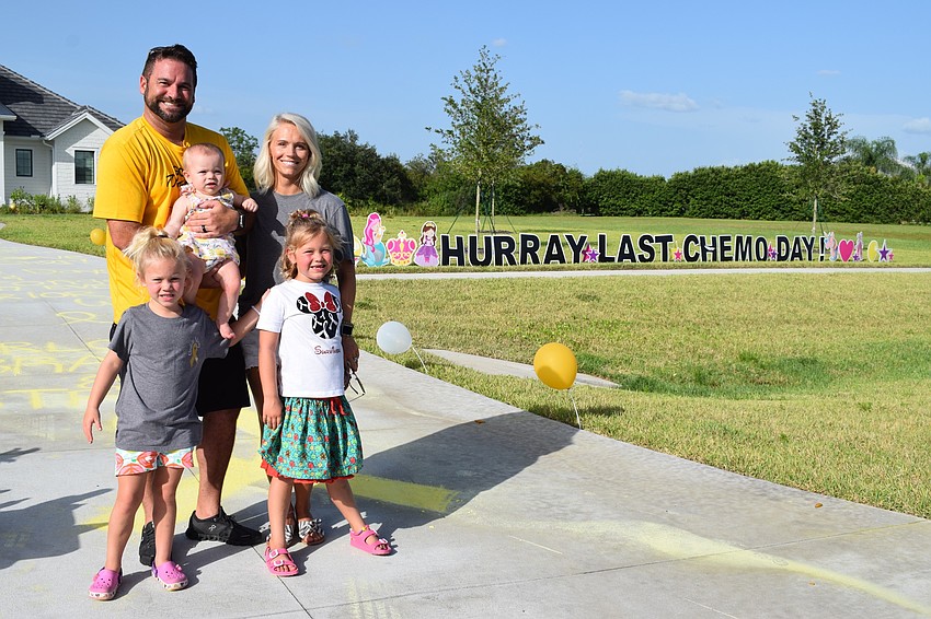 Matt, Madison, Rachel, Savannah and Charlotte Wells celebrate Charlotte Wells' last day of chemotherapy.
