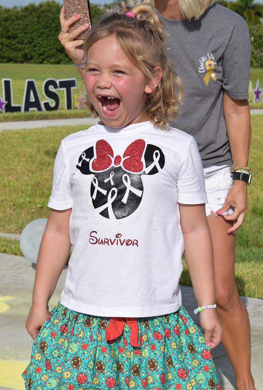 Charlotte Wells can't believe emergency medical services vehicles and firetrucks are coming down her street.