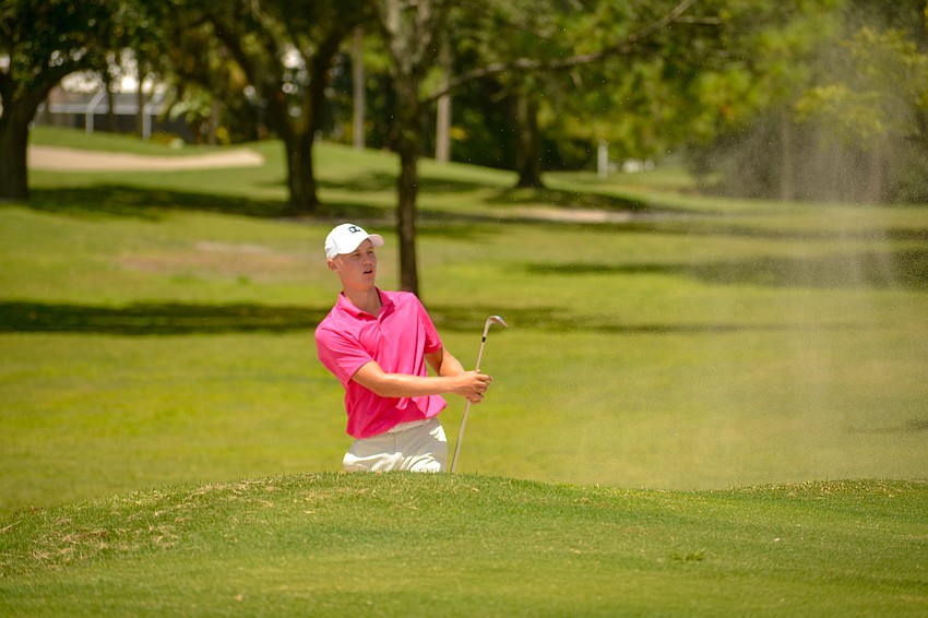 Jake Naese, who attends The Out-of-Door Academy, hits his ball out of a bunker on hole No. 4.
