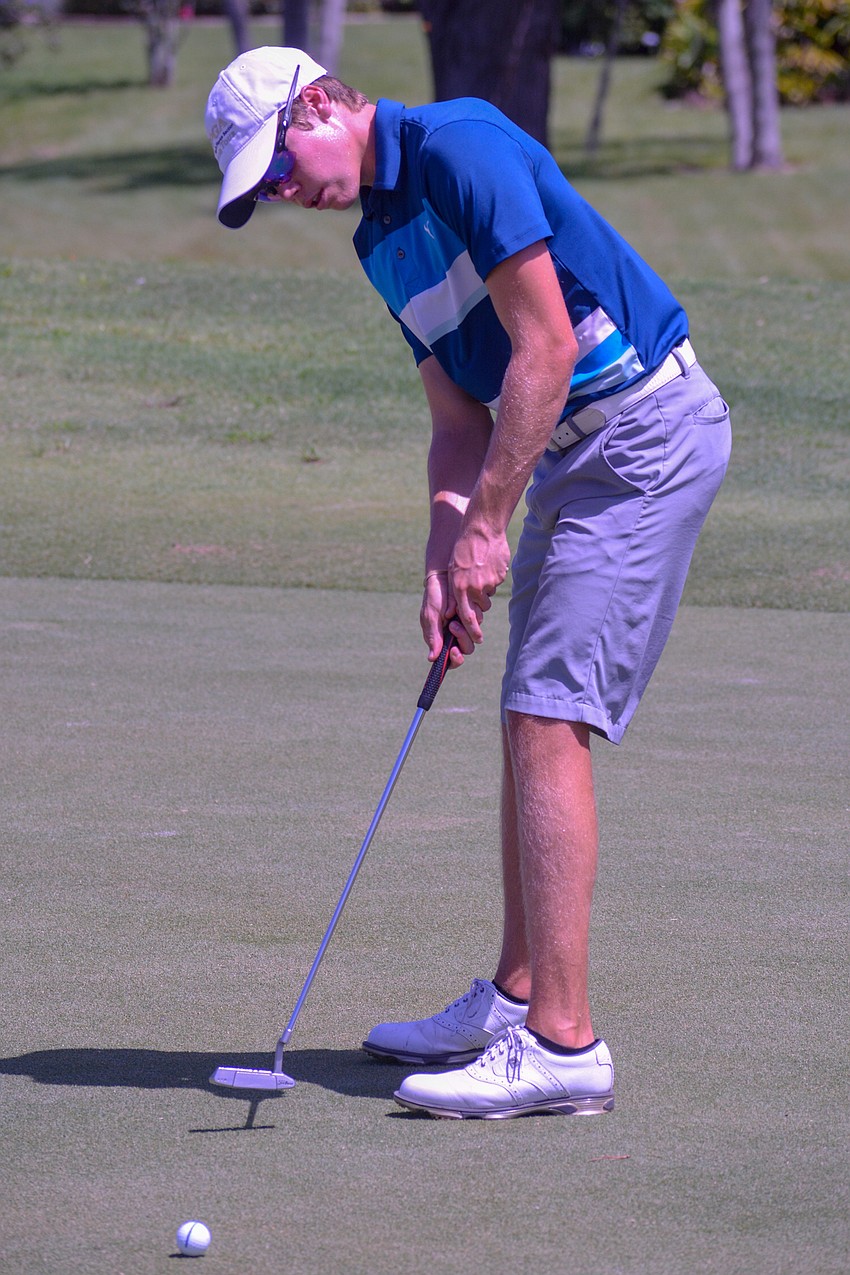 Jonah Winter, who attends Booker High, sinks a putt on hole No 4.