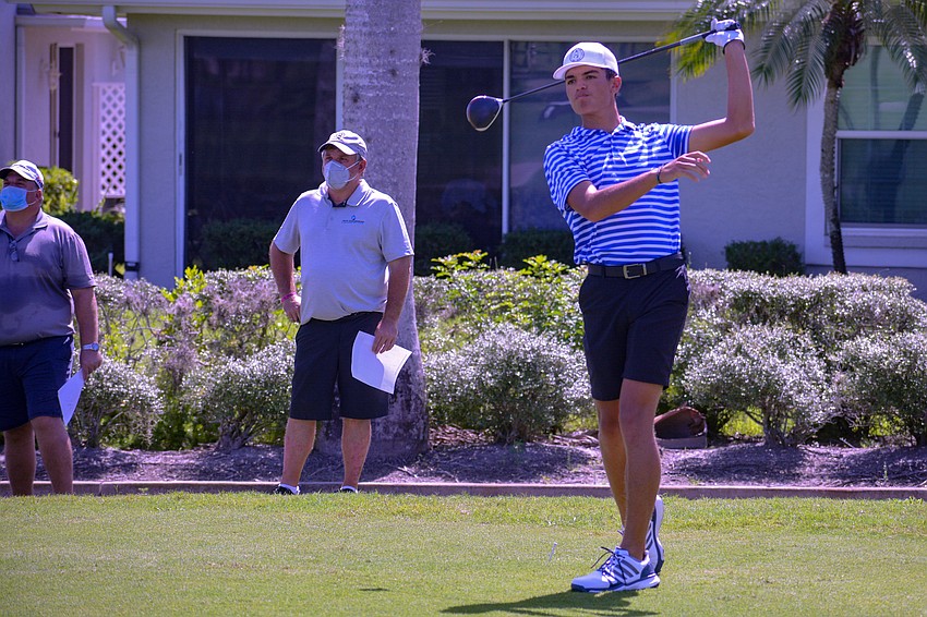 Russell Aetonu watches his drive on hole No. 1 hit the fairway.