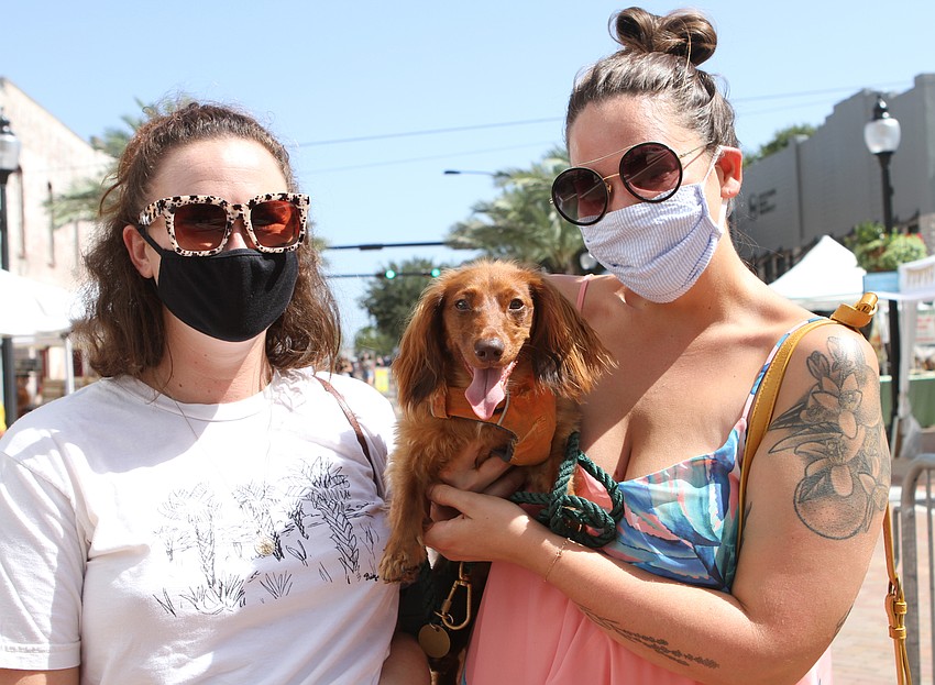 Sami Shobe, Larry the dog and Kate Douglas enjoyed the sun.