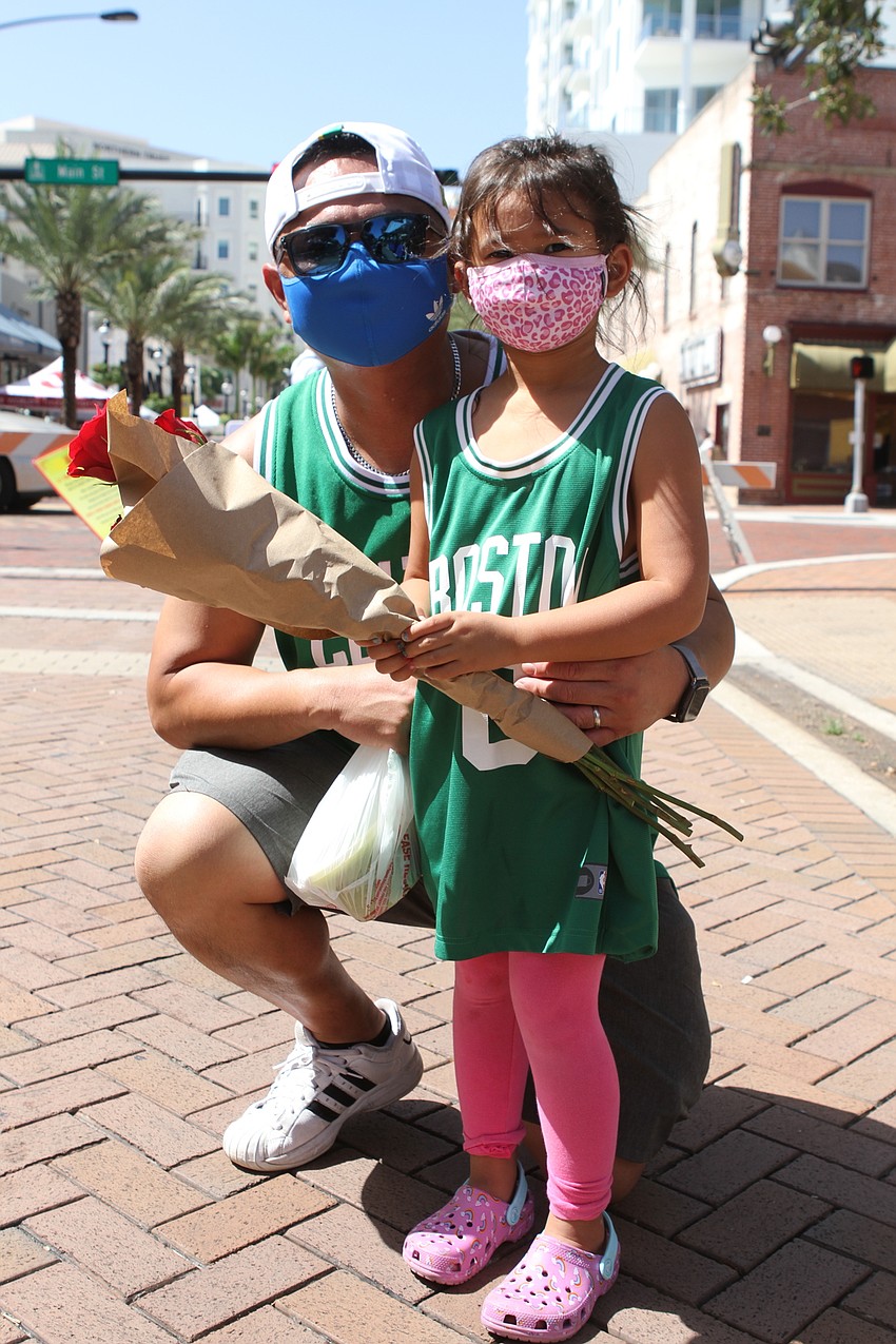 Linh and Eloise Chau picked up roses as a surprise for mom.
