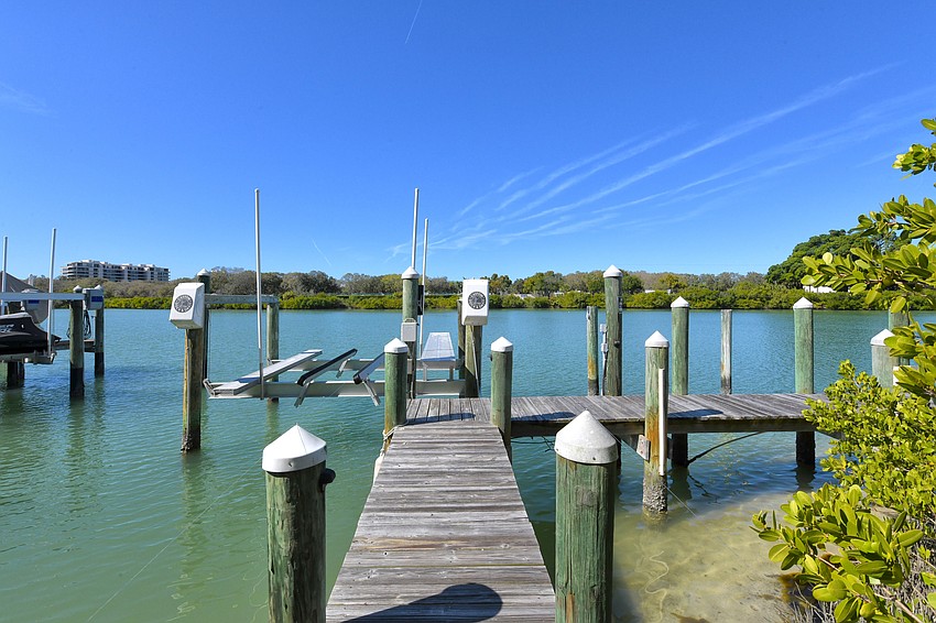 The dock includes a fishing pier and boat lift.