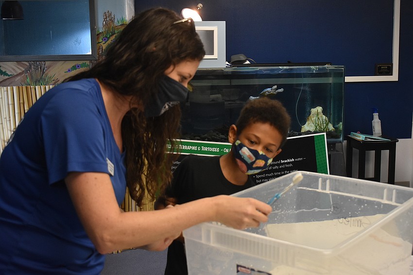 Dana Henderson leads Eli Wheaton through spa day.