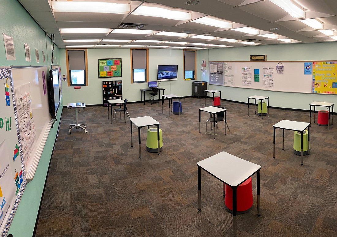 Faith Bench, a math teacher at Braden River Middle School, has removed some of the desks in her classroom to ensure the desks will be spaced out six feet to practice social distancing. Courtesy photo.