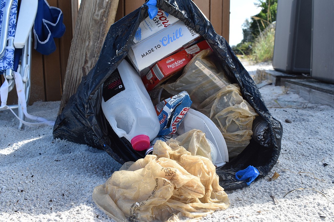 Beach trash is pictured near the public beach access point at 100 Broadway Street.