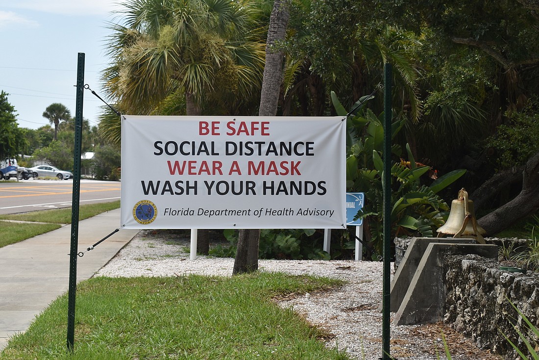 The town of Longboat Key has posted several of these "wear a mask" signs throughout the island. Photo courtesy of Nat Kaemmerer.