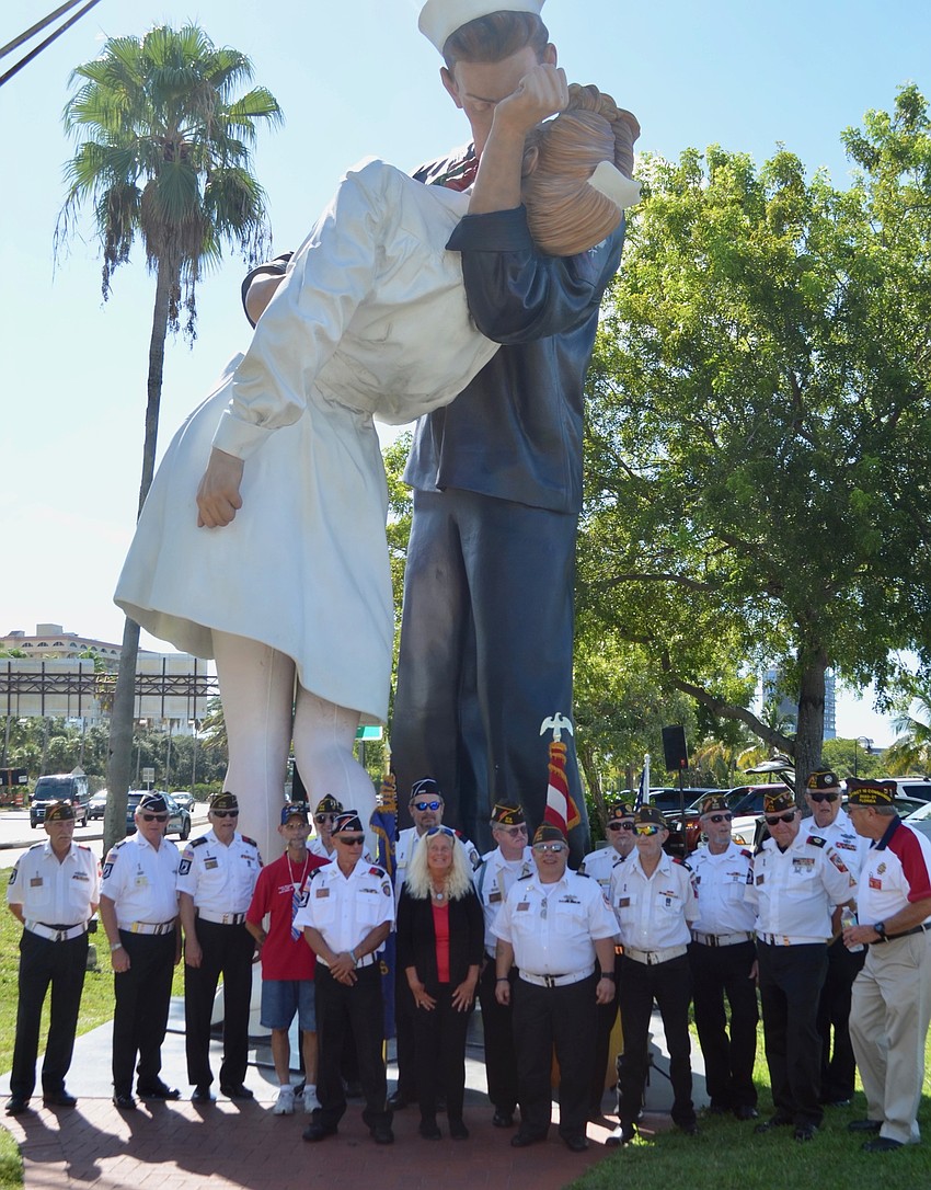 Members of Sarasota's VFW Post 3233 gather for a photo in front of Unconditional Surrender.