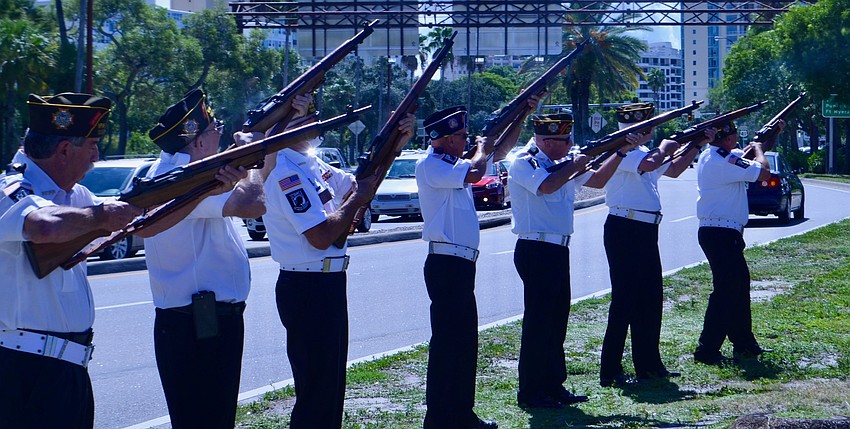 Members of the American Legion fired a 21-gun salute alongside Tamiami Trail.