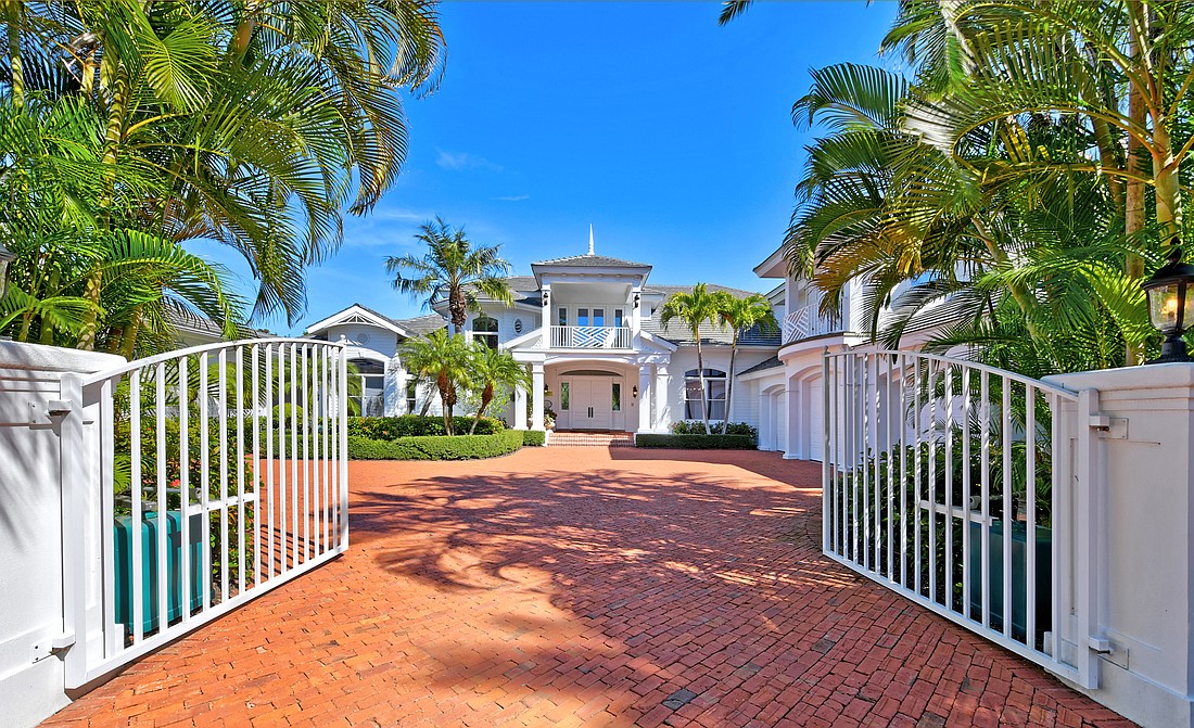 Built in 2002, the home at 15 Lighthouse Point Drive has five bedrooms, seven-and-a-half baths, a pool and 9,157 square feet of living area.