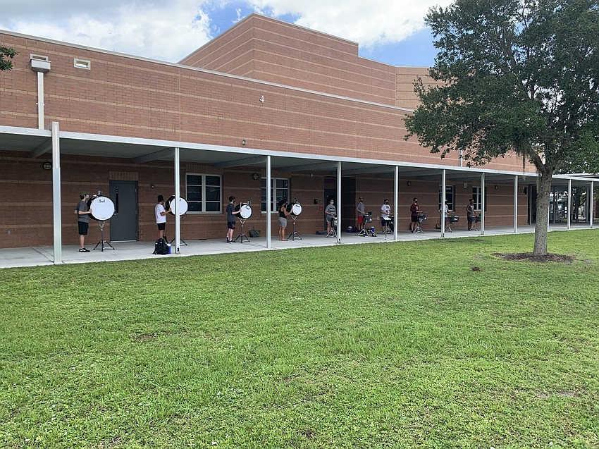 The Braden River High School Marching Band of Pirates' drumline practices social distancing while rehearsing. Jeramiah Bowman, director of the band, says students are excited to be back playing music with friends. Courtesy photo.