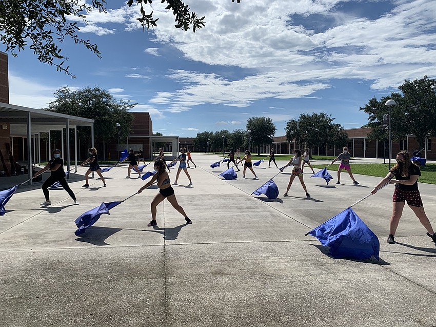 Color guard members follow Centers for Disease Control and Prevention guidelines while rehearsing. Courtesy photo.