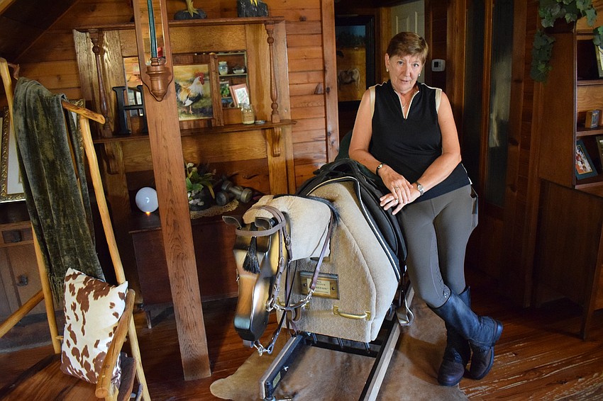 An Equicizer provides a workout in Deb Herbert's log cabin.