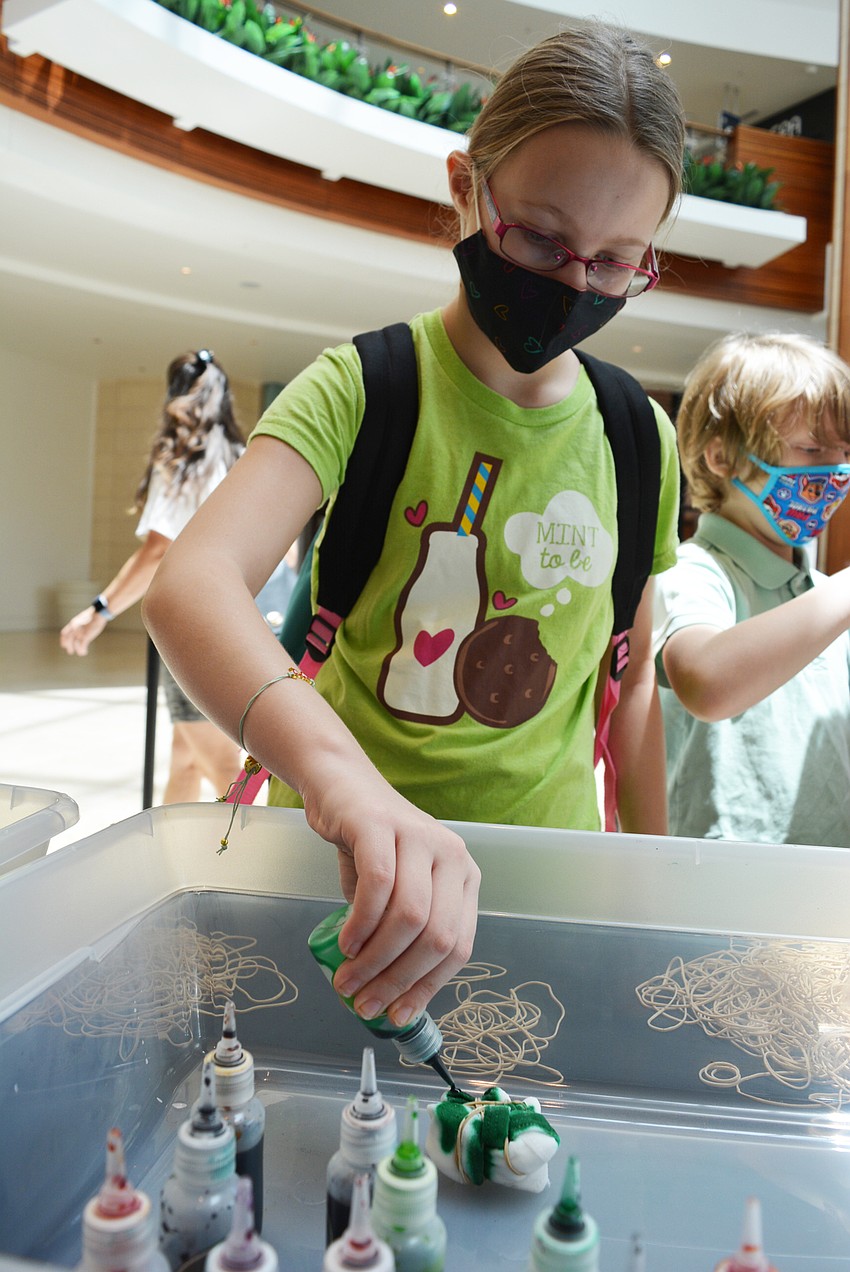 East County's Christi Humphreys, 10, chose to make her tie-dyed mask green and white.