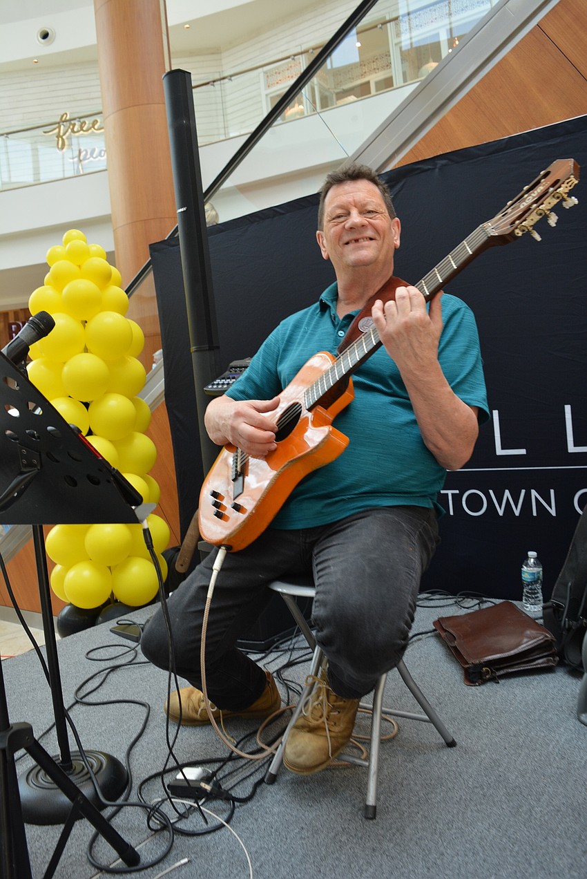 Paul Buzine provided musical entertainment for guests as they tie-dyed face masks and participated in other activities in that area.
