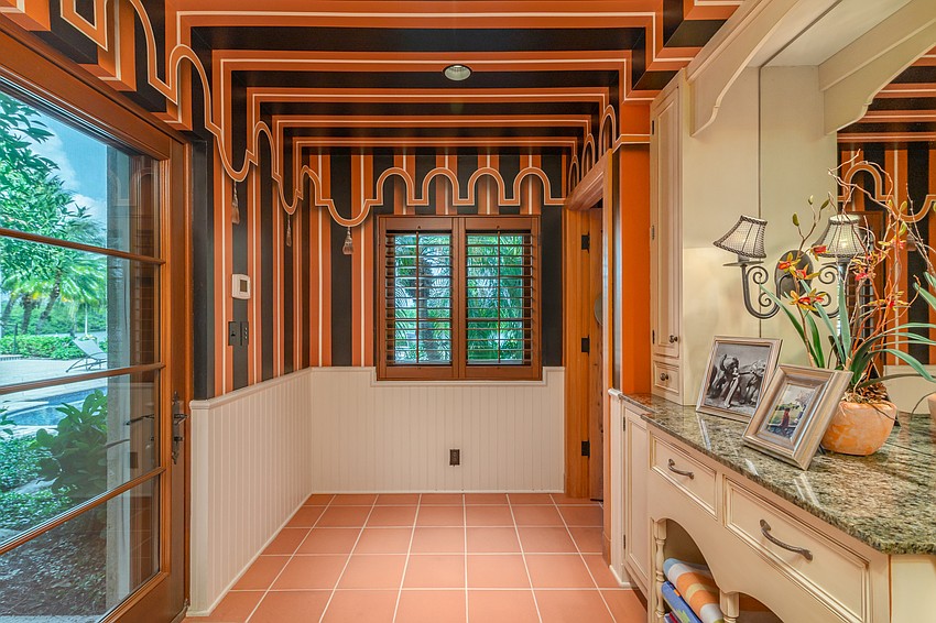 Another bathroom features circus wallpaper.