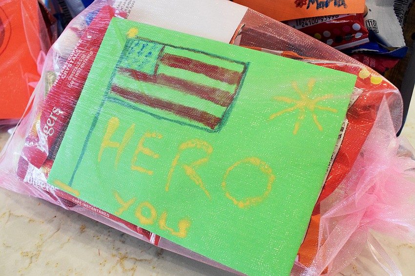 Children create thank you notes to show support for the Manatee County Sheriff's Office.